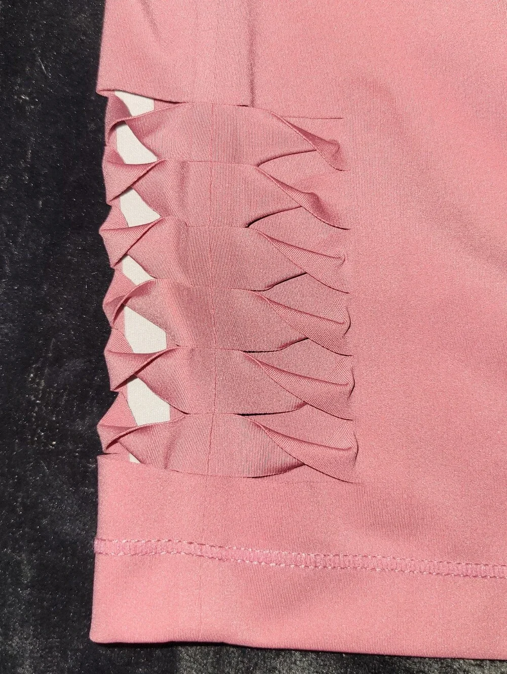 pink Nike Pro Dri-FIT crop top featuring distinctive side-cutout details